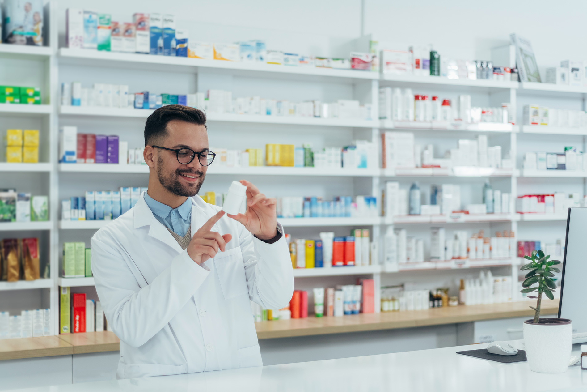 Professional pharmacist assisting with a medical drugstore setup in UAE, representing MOHAP compliance and healthcare supply.